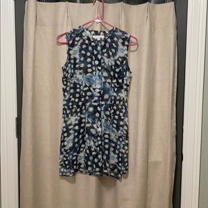 Blue sleeveless blouse with split sides